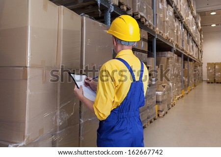 Warehouse worker checking products ready to be send