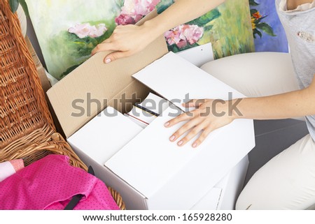 Woman finish packing and leaving boxes ready to moving