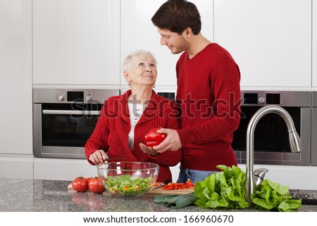 Grandma and granson enjoy cooking together