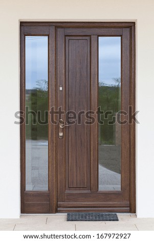 Vertical photo of a wooden entrance door