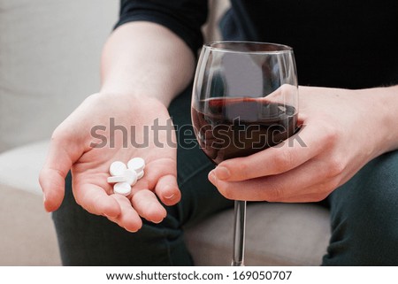 Woman trying to kill pain with pills and alcohol