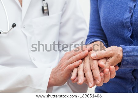 A doctor showing feelings of support towards his patient