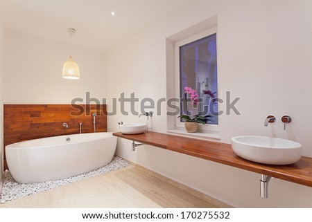Interior Of Modern Spacious Bathroom With Window
