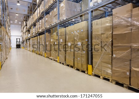 Metal Stillage In A Warehouse With Cartons
