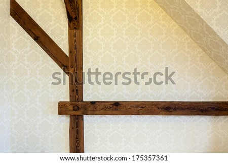 Structural Wooden Beams On Wall With Decorative Wallpaper