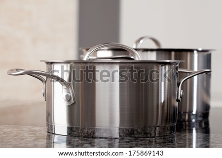 Two new clean aluminum pots in the professional restaurant kitchen