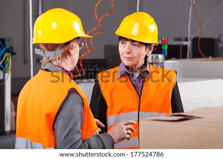 Middle aged women working as a managers at factory