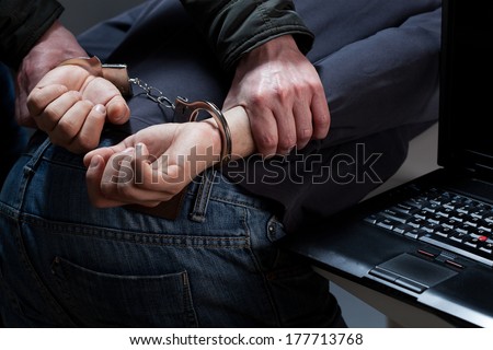 Close up of hands in handcuffs during arrest