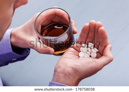 Man wanting to commit suicide by taking pills with brandy