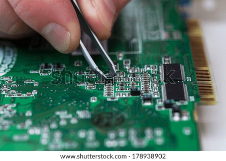 close up of repairing circuit printed board
