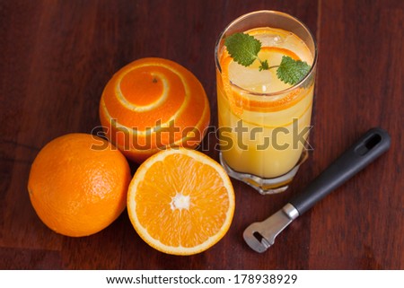 Orange long drink decorated with mint, horizontal