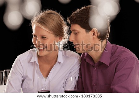 A young couple having a nice night out with friends