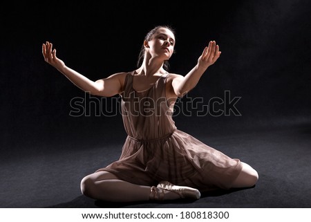 Ballet dancer acting in play on a stage.