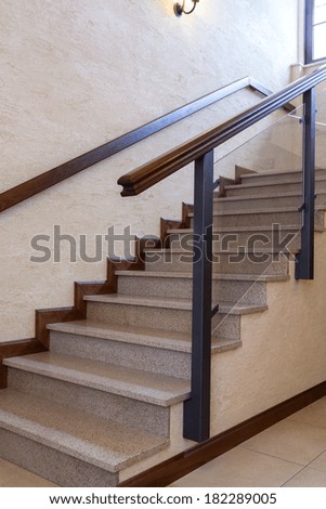 Contemporary staircase, stone and wood, vertical photo