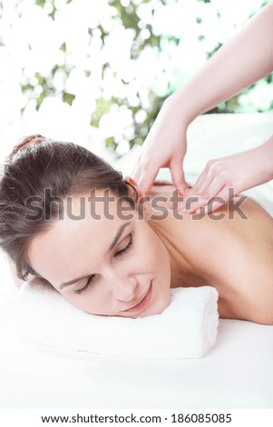 Beautiful smiling woman getting professional spa treatment