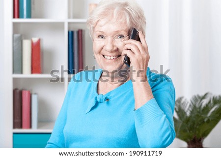 Smiley elderly woman talking on the mobile phone