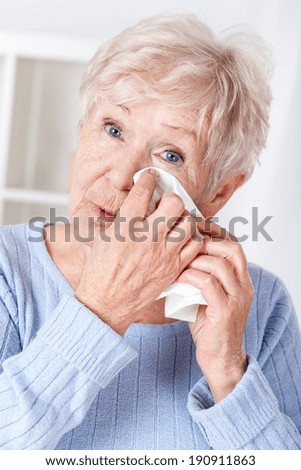 Portrait of sad elderly woman crying,vertical