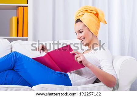 Woman laughing during watching a photo album