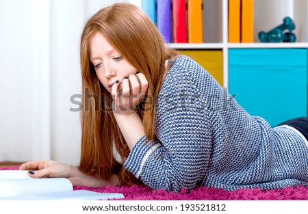 Teenage girl is focused on learning and reading
