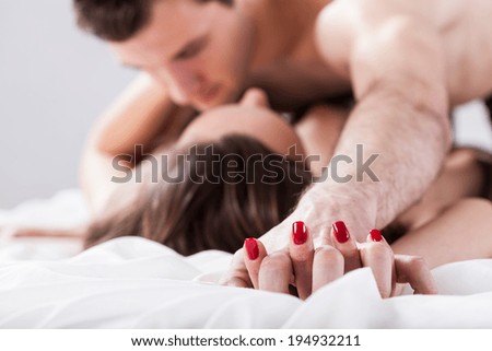Young couple having affair on isolated background