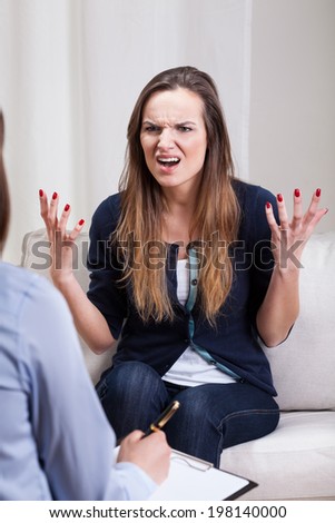Vertical view of a mad woman during therapy