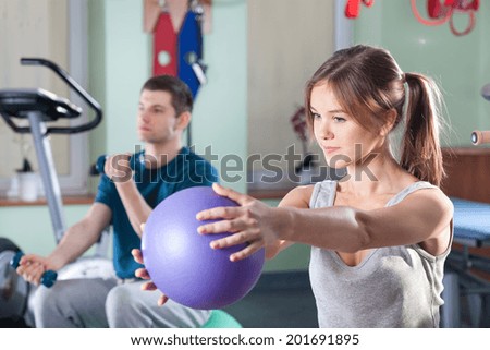 People during physical exercises at rehabilitation room
