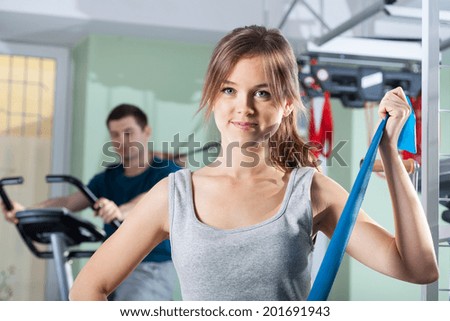 Horizontal view of people doing rehabilitation exercises at physiotherapy clinic