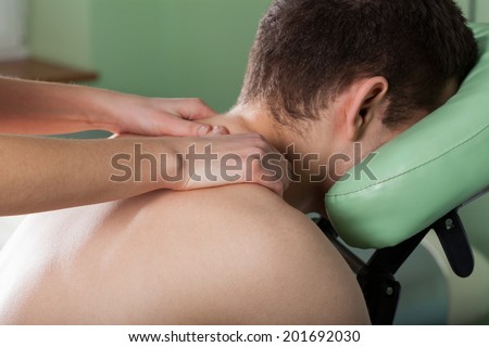 Close-up of a relaxation neck massage for young man