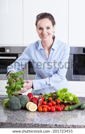 Smiling female chef preparing a healthy meal