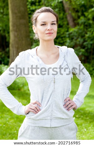 Training woman on the open air, vertical