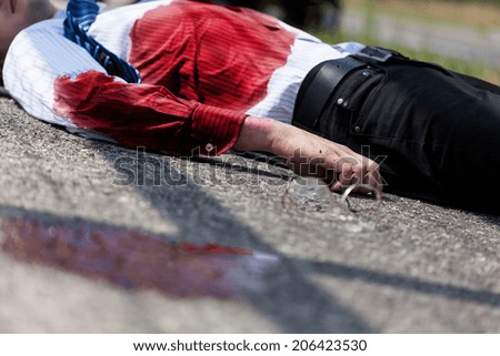Dead bleeding man after car accident, horizontal