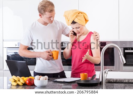 Busy couple drinking tea in the morning