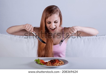 Horizontal view of skinny girl eat dinner