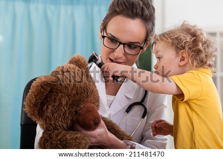 Little boy with bear at pediatrician\'s office