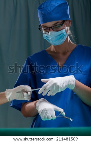 Vertical view of female surgeon during surgery