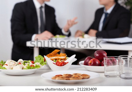 Close-up of a food and men during lunch break