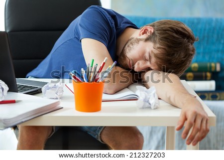 Student sleeps on the desk after learning