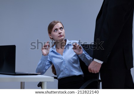Woman is afraid of her boss in the office