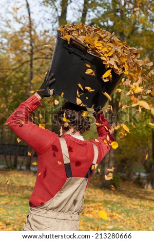 An angry gardener about to throw all grabbed leaves out of the box