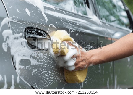 Horizontal close-up of the car\'s door cleaning