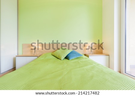 Interior of bedroom with green wall, horizontal