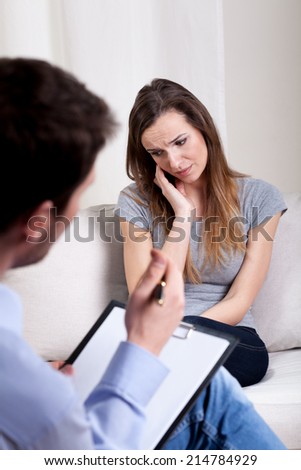 Psychotherapist listening in focus about patient mental problems