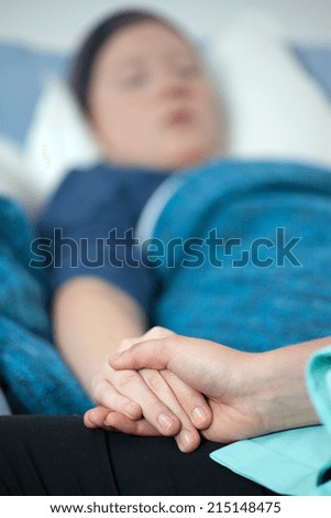 View of doctor supporting woman with cancer