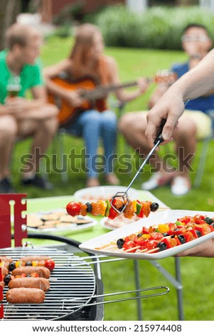 Party in a garden during summer, vertical