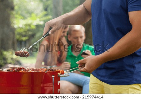 Friends during barbecue on a party in garden