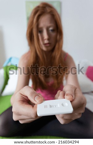 Young desperate teenage girl done a pregnancy test