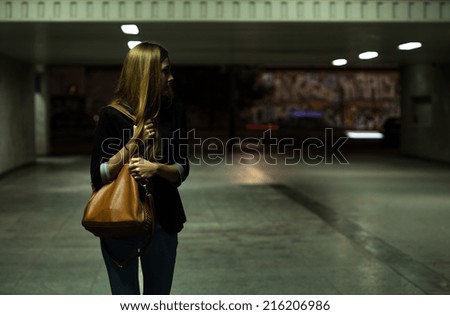 View of lonely woman in the underpass