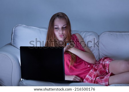 Girl in pyjamas talking with her boyfriend before sleeping