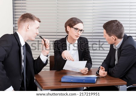 Business team trying to resolve problem at work