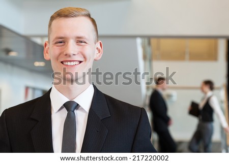 Image of young elegant man working in corporation